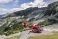 WHISTLER, CANADA - AUGUST 25, 2019: red helicopter on Blackcomb mountain for air lookup tour Royalty Free Stock Photo