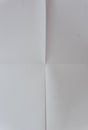 Whit paper texture. White paper sheet texture folded in four. White paper sheet folded in vertical and horizontal half