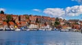 Whitby abbey is a seaside town and port at daytime in North Yorkshire, UK Royalty Free Stock Photo