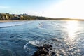 WHITBY in ENGLAND. People walking on Whitby beach on a fine sunny, windy day. In Whitby, North Yorkshire, England Royalty Free Stock Photo