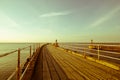 WHITBY, ENGLAND  Tourists visiting Whitby Pier and lighthouse. 12/05/2019 Royalty Free Stock Photo