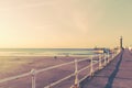 WHITBY, ENGLAND  Tourists visiting Whitby Pier and lighthouse in May Royalty Free Stock Photo