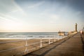 WHITBY, ENGLAND  Tourists visiting Whitby Pier and lighthouse. 12/05/2019 Royalty Free Stock Photo