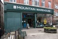 Entrance to Mountain Warehouse outdoor clothing and equipment shop store showing window display, sign, signage, branding and logo