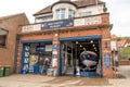 Exterior of RNLI Whitby Museum showing exhibition boat and shop entrance