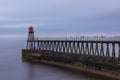 Whitby harbour entrance, east pier and beacon, Yorkshire, UK. Royalty Free Stock Photo