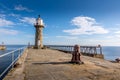 Whitby Lighthouse and historic harbour entrance - North Yorkshire, England Royalty Free Stock Photo