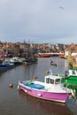 Whitby North Yorkshire fine calm winter weather was enjoyed by sailors and visitors to the harbour