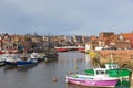 Whitby North Yorkshire fine calm winter weather was enjoyed by sailors and visitors to the harbour