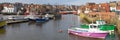 Whitby North Yorkshire fine calm winter weather was enjoyed by sailors and visitors to the harbour panoramic view
