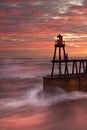 Whitby Pier as the sun rises Royalty Free Stock Photo