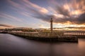 Whitby pier and lighthouse at the entrance to the harbour Royalty Free Stock Photo