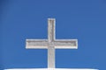 White adobe cross against a very blue sky - closeup Royalty Free Stock Photo