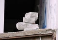 White aerated concrete pieces stacked pile of an abandoned building.