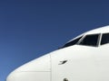 White Aeroplane Nose against clear Blue Sky 3 Royalty Free Stock Photo