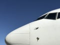 White Aeroplane Nose against clear Blue Sky 2 Royalty Free Stock Photo