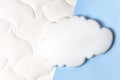 White air cloud on a comfortable mattress texture background and blue background top view. White texture of mattress bedding Royalty Free Stock Photo