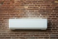 White air conditioner sits on top of brick wall. This versatile image can be used to depict various settings, such as re