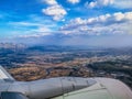 White aircraft turbine against the background of the bright panorama of the Antalya suburb in Turkey. Airplane window view of Royalty Free Stock Photo