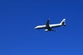 White airplane of Aegean airlines on blue sky