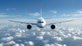 A white airplane flying in the sky, plane is seen from front view, plane has two engines on each side