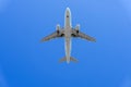 Airplane flying under the sky. Royalty Free Stock Photo