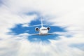 White airplane with motion blur effect is flying over clouds Royalty Free Stock Photo