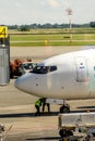 White airplane parked on airport