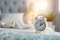 white alarm clock on bedside table in bedroom, woman sleeping on bed in background. AI Generated Royalty Free Stock Photo