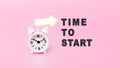 White alarm clock in pink background with text - TIME TO START. The concept of business, motivation and time. Banner with alarm Royalty Free Stock Photo