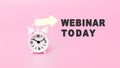 White alarm clock in pink background with text - WEBINAR TODAY. The concept of business, motivation and time. Banner with alarm Royalty Free Stock Photo