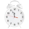 White alarm clock showing twelve o`clock isolated on white background Royalty Free Stock Photo