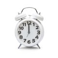 White alarm clock at 12.00 twelve o`clock, noon isolated on white background clipping path