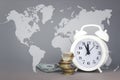 White alarmclock with Coins stack and stack of one hundred dollar bills with Digital Earth planet Global world map symbol on grey