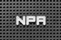 White letter in word NPA Abbreviation of Non performing assets or Nasopharyngeal airway on black pegboard background