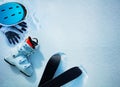 White alpine ski boot helmet and gloves in snow from above Royalty Free Stock Photo