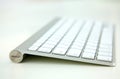 White aluminum keyboard isolated at the studio.