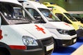 White ambulance cars with a red cross