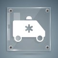 White Ambulance and emergency car icon isolated on grey background. Ambulance vehicle medical evacuation. Square glass