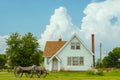 White American gothic style house with cart Royalty Free Stock Photo