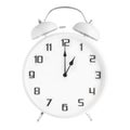 White analog alarm clock showing one pm or 1 am isolated on white background Royalty Free Stock Photo