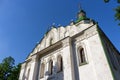 White ancient christian church with golden cross on top against clear blue sky. Religion and faith concept. Church exterior. Royalty Free Stock Photo