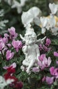 White angel and pink flowers Royalty Free Stock Photo