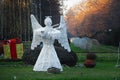 A white angel silhouette that sings at violin in the park Royalty Free Stock Photo