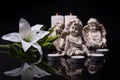 White angels with candles and white lily flower on a black background Royalty Free Stock Photo