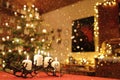Festive Illuminated Christmas Chamber Scene behind Falling Snow