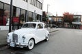 White Antique Austin Car on City Street