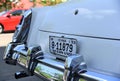 A white antique Cadillac proudly displays its Iowa license plat