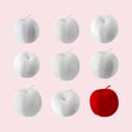 White apples with red apple on pink pastel background. Royalty Free Stock Photo