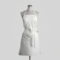 White apron on a mannequin isolated on a gray background